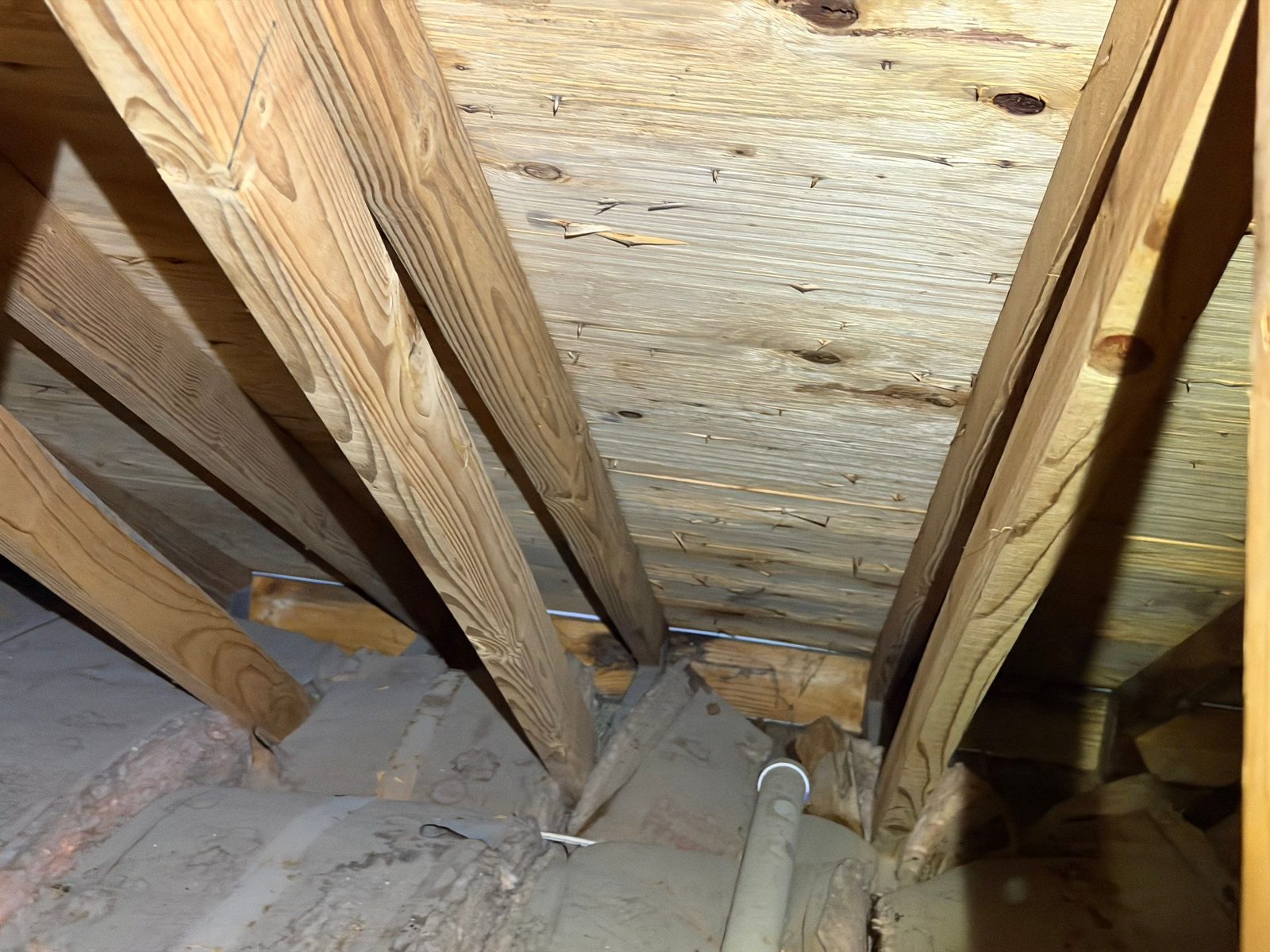 Attic roof sheathing and rafters after a job