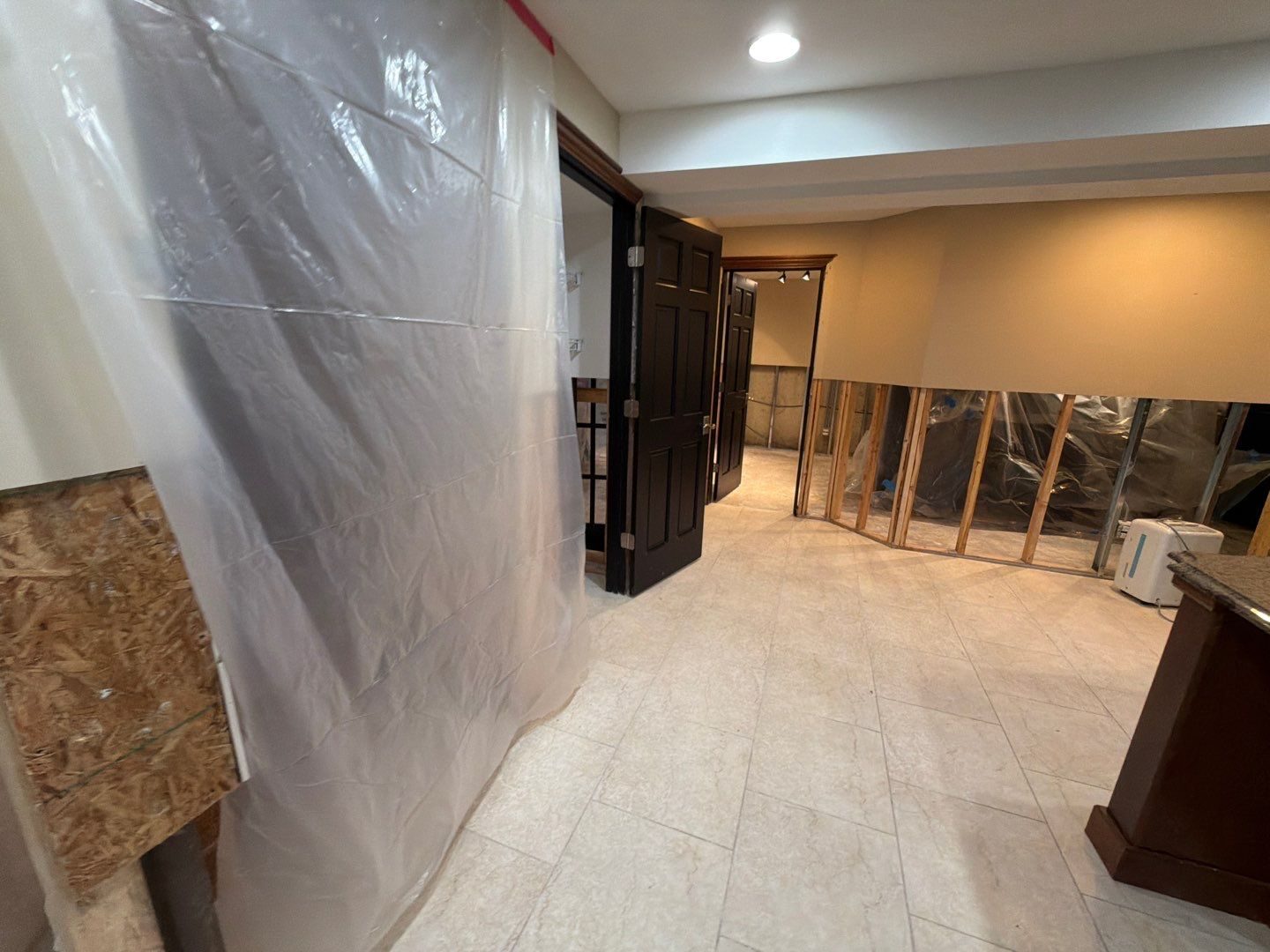 Flood cut and plastic containment during water mitigation