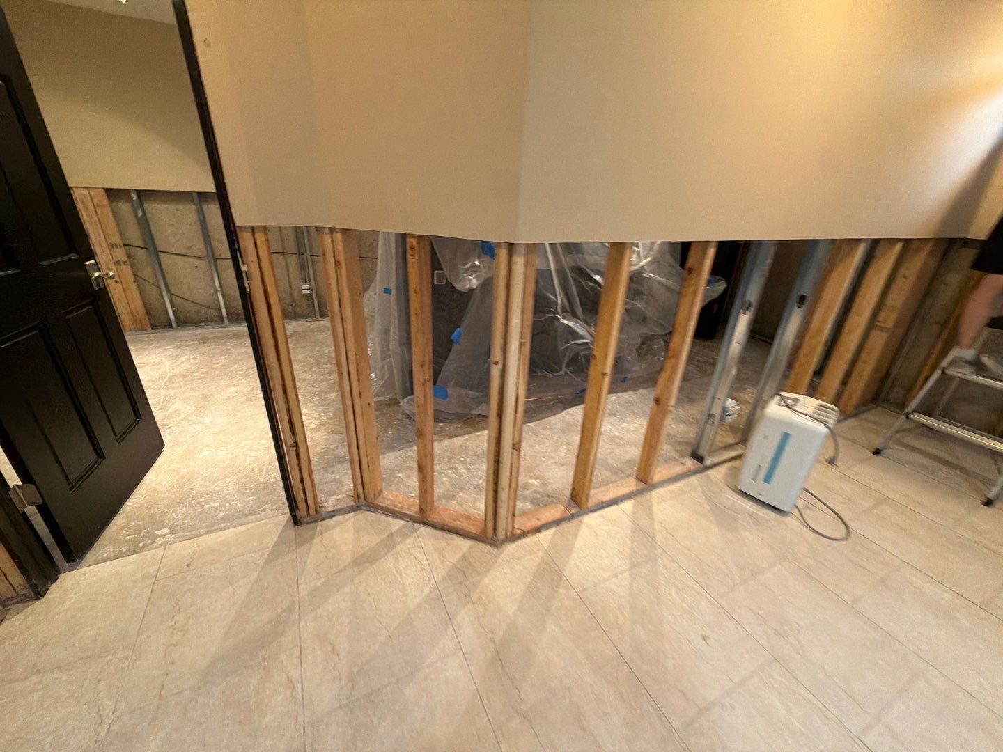 Flood-cut walls with a dehumidifier on the floor